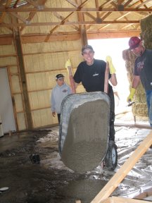 Concrete gets dumped by hand