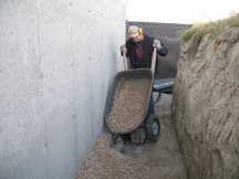 Pouring gravel over the weeping tile