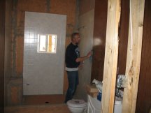 Working on the shower wall